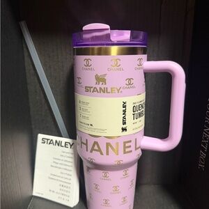 Stanley Pink Tumbler with Gold Accents and Purple Lid